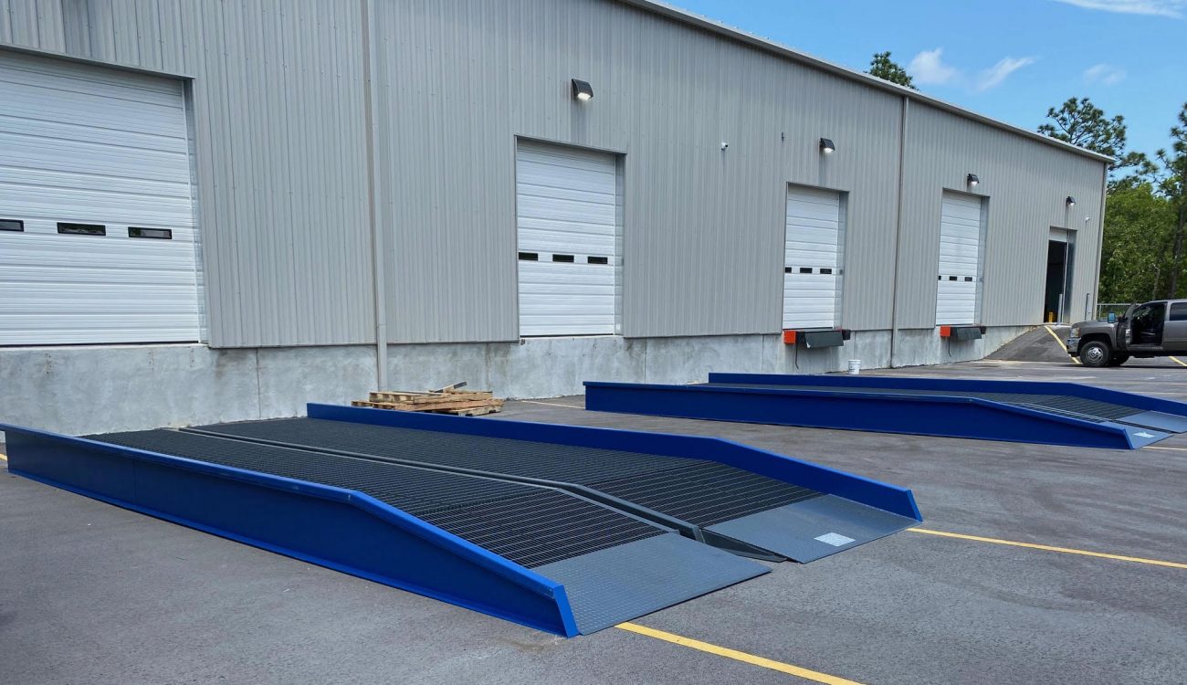 A pair of blue loading docks outside of a warehouse in Asheville, NC.