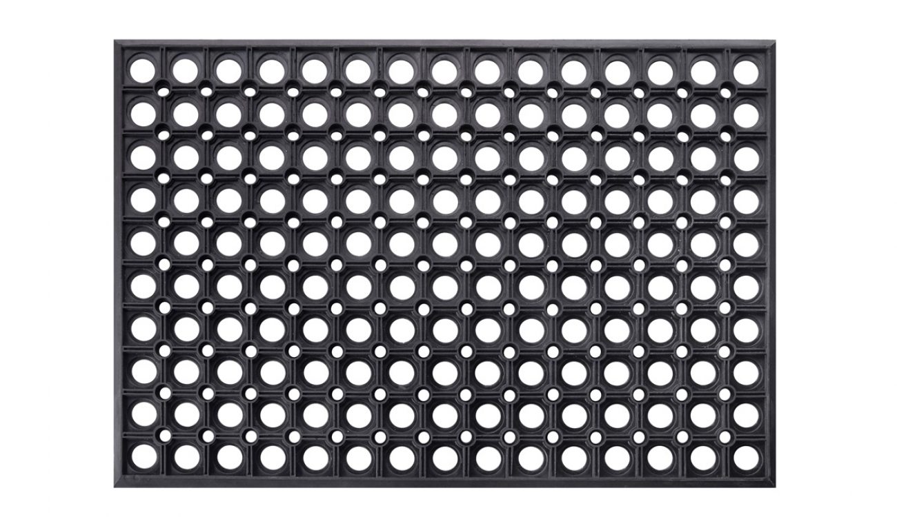 A black rubber anti-fatigue mat against a white background in Asheville.